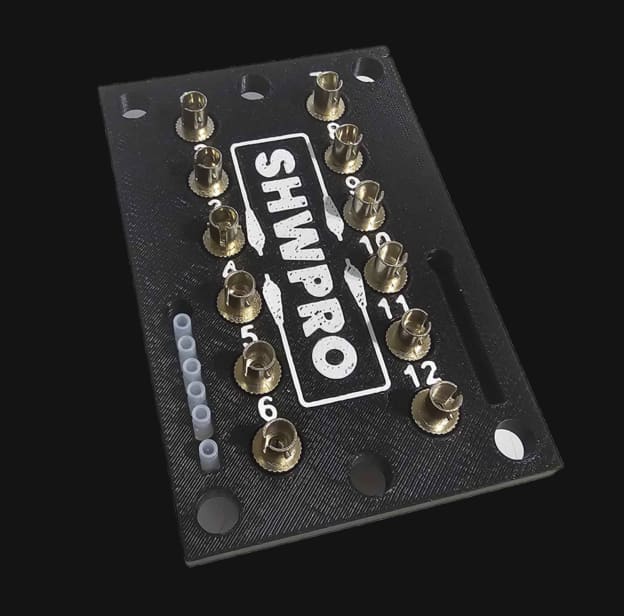 ST Patch Panel in black PETG with brass ST barrels installed and ports numbered 1 to 12