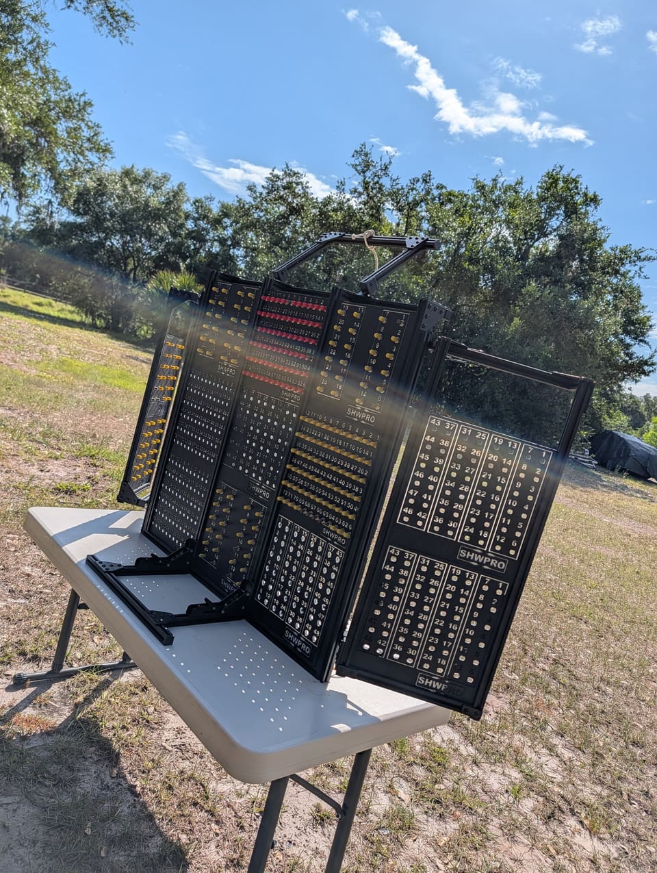 Control Station on a table photographed from the side, showing the angled panels
