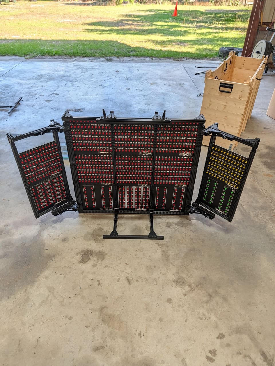 Control Station standing on a garage floor with both side arms open