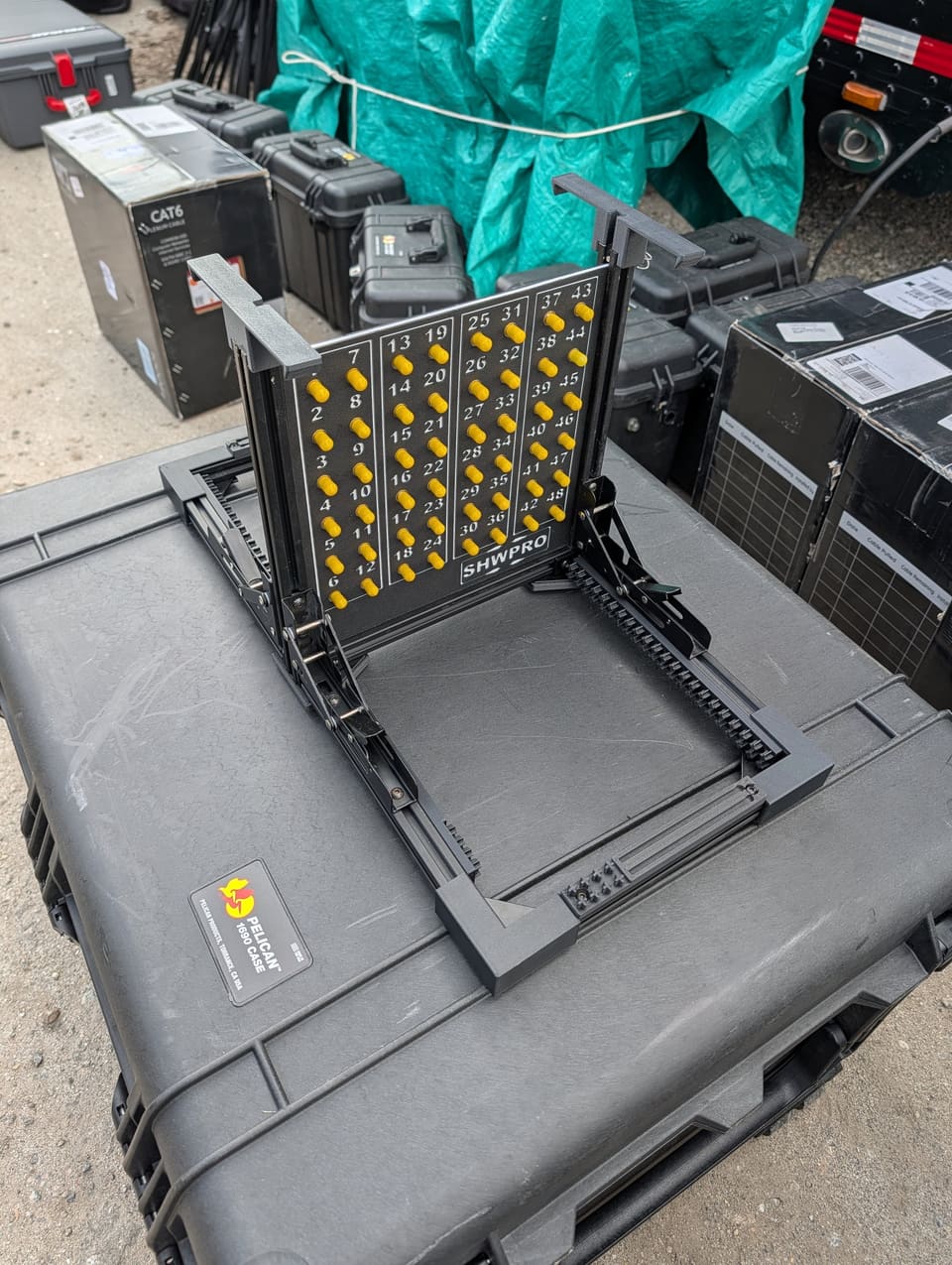 The Frame holding a populated fiber panel on top of a black road case